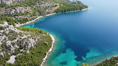 Aerial-Drone-View-of-the-Turquoise,-Crystal-Clear-Adriatic-Sea-along-the-coast-of-Dalmatia,-Croatia