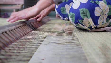 Close-up-of-the-process-of-sedge-mat-weaving-popular-in-asian-tradition
