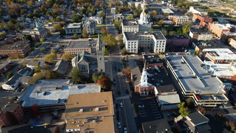 Aerial-View-of-Downtown-Concord,-New-Hampshire-State-Capital,-Central-Buildings,-Streets-and-Neighborhood-on-Sunny-Autumn-Day,-Drone-Shot