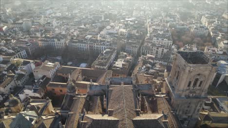 Aerial-forward-view-over-the-cathedral-and-its-wide-city