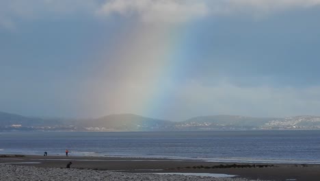 Scenic-colourful-rainbow-over-Welsh-mountains-coast-skyline
