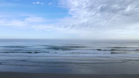 Lone-paddle-boarder-far-in-the-distance-at-Nantasket-beach,-Massachusetts