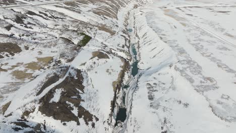 Snowy-Landscape-Canyons-of-Glacier-Valley,-Jokuldalur-in-East-Iceland---Aerial