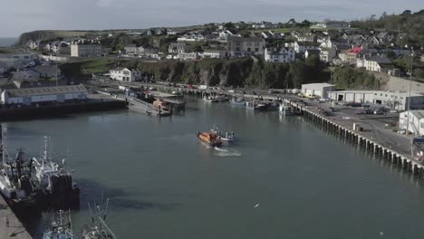 Picturesque-Irish-Dunmore-East-Harbour-with-orange-Coast-Guard-vessel