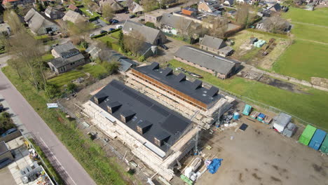 Cinematic-aerial-of-solar-panels-on-rooftop-of-newly-constructed-homes