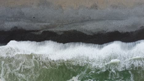 Drone-4k-footage-of-a-rocky-beach-in-Lima,-Peru