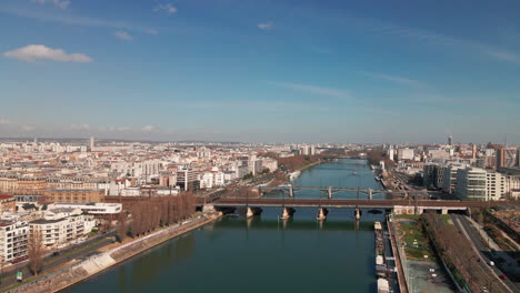 Aerial-shot-of-La-seine-in-France,-with-little-bridge