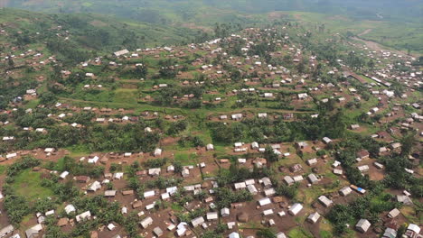 Aerial-flyover:-Hilly-Congolese-jungle-towns-use-every-available-space