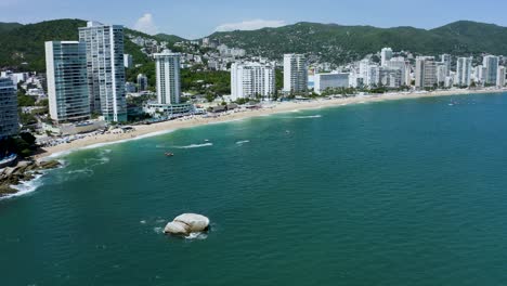 Tropical-Real-Estate-on-Pacific-Ocean-Coast-of-Acapulco,-Mexico---Aerial
