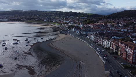 North-Wales-seaside-town-resort-coastline-harbour-breakwater-aerial-view-orbit-left