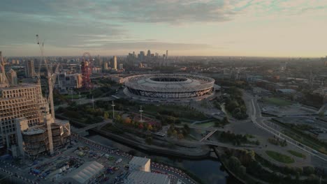 West-Ham-United-football-stadium-landmark-venue-with-London-city-aerial-view-right-orbit-above-cityscape