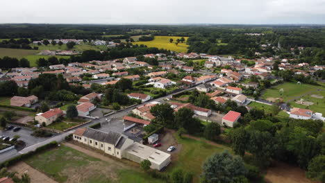 Talmont-Saint-Hilaire-town-and-main-road-aerial-tilt-down-panoramic-view,-France