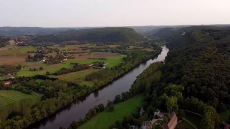 Aerial-view-of-Dordogne-river-Old-medieval-stone-village-of-Beynac-et-Cazenac