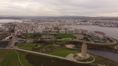 Drone-fly-above-la-coruna-Hercules-old-lighthouse-and-urban-modern-district