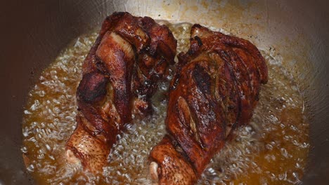 Already-turned-and-still-cooking-the-underside,-golden-brown-fried-meat-inviting-to-a-lovely-meal