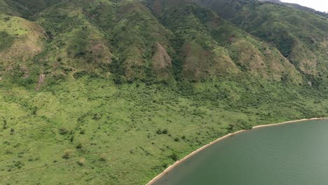 Green-mountainous-flight-along-western-shore-of-Congo's-Lake-Edward