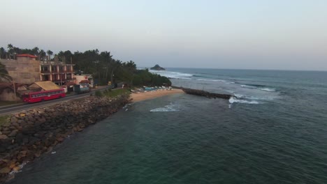 FPV-Drone-Flying-Fast-Above-Blue-Ocean-Shore-With-A-Quick-Street-View,-Sri-Lanka