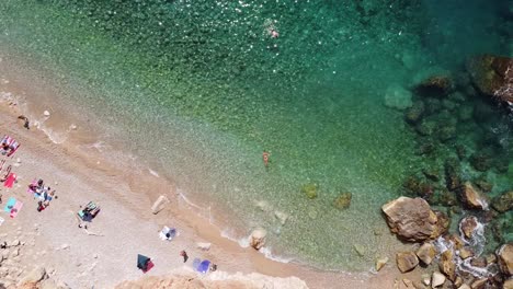 Hidden-Sandy-Pasjaca-Beach-in-Dalmatia,-Croatia---Aerial-Top-Down-Ascending