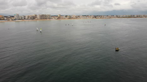Aerial-drone-forward-view-of-boat-race-in-Saint-Malo-in-France