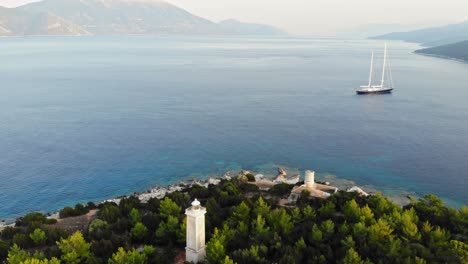Lighthouse-Of-Fiskardo-And-The-Wonderful-Outdoor-Scene-of-Kefalonia-Island,-Fiskardo-village,-Greece,-Europe---aerial-drone-shot
