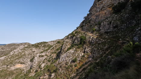 4k-Shot-of-a-rocky-tourist-hiking-trail-on-a-mountain-at-La-Concha,-Marbella,-Spain