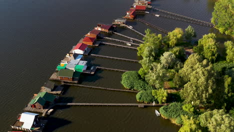Slow-moving-drone-shot-of-Bokodi-hutoto-lake-and-stilt-village-in-Hungary