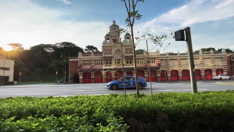 Gimbal-Shot-Of-The-Central-Fire-Station-And-Moving-Vehicles-On-The-Road,-In-Singapore-During-The-Day