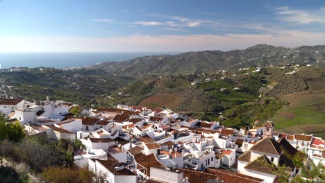 Stunning-view-over-white-houses-in-Frigiliana,-Spain-with-landscape-and-ocean