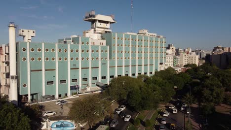 Drone-moving-towards-building-of-Naval-Hospital,-Buenos-Aires,-Argentina