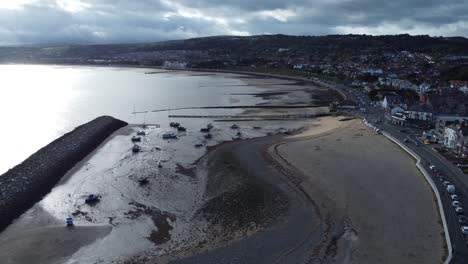 North-Wales-seaside-town-coastline-hotels-harbour-breakwater-aerial-view-rising-right