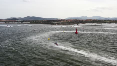 drone-image-panning-over-the-sea-water-full-of-blazing-fast-jet-ski-while-training-for-the-world-cup
