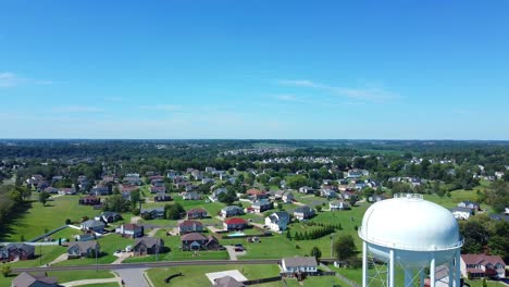 Panorama-Of-A-Water-Tower-And-The-Village-Surrounded-With-Green-Forest