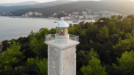 Beautiful-White-Venetian-Lighthouse-And-Coastal-Scenery-Of-Kefalonia-Greece---aerial-shot