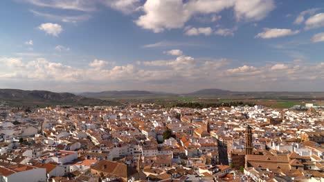 Panoramic-daytime-view-over-Antequera-city-in-Spain-with-blue-and-cloudy-sky