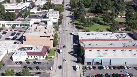 Aerial-view-above-Fairoaks-Los-Angeles-California-vehicles-driving-lanes-in-urban-street-view