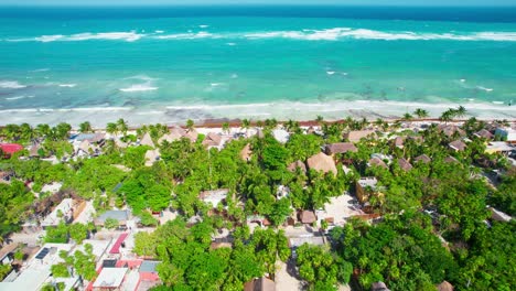 Aerial-Drone-View-Of-Lush-Green-Mainland-Resorts-and-Hotels-In-Tropical-Carribean-Beach