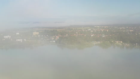 Drone-shot-through-the-clouds-revealing-Kezthely-in-Hungary