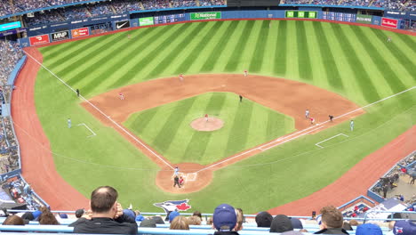 Ballpark-Baseball-Stadium-Stands-Bleachers-High-Angle-View,-Professional-Major-League-Match-Blue-Jays-Toronto-Club-Vs-Red-Sox,-Players-Playing-on-Green-Field,-Crowd-Supporters-Fans-in-Stands-Watching