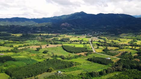 Aerial-view-of-Beautiful-sky-road-over-top-of-mountains-with-green-jungle-in-Nan-province,-Thailand