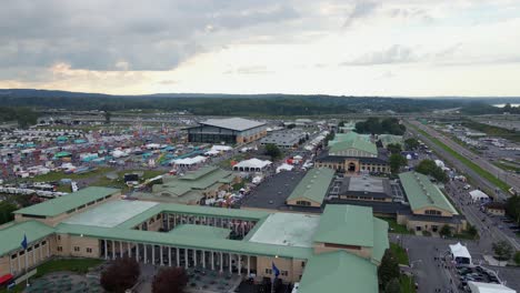 Aerial-view-of-the-New-York-state-fair,-sunset-in-Syracuse,-USA---pan,-drone-shot
