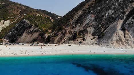 Rugged-Cliff-And-Lush-Woods-At-The-Seacoast-Of-The-Famous-Myrtos-Beach-In-Kefalonia,-Greece