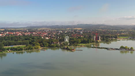 Drone-aerial-shot-of-Kezthely,-Hungary-with-lake-in-the-foreground