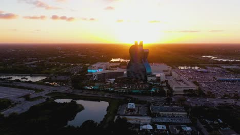 Aerial-view-around-the-Seminole-Hard-Rock-Casino-resort,-during-sunset---circling,-drone-shot