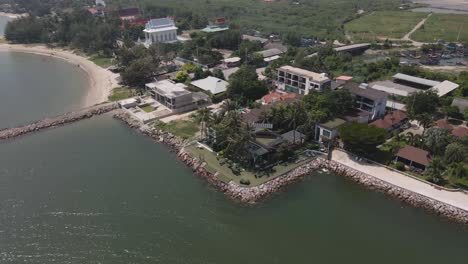 4K-Aerial-Drone-Footage-of-a-Hotel-Resort-Along-the-Coastal-Area-of-Ban-Laem-in-Phetchaburi,-Thailand