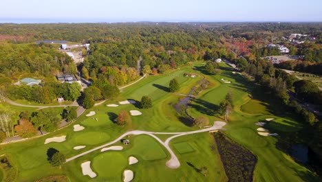Birds-eye-view-over-beautiful-golf-course-amidst-dense-greenery-at-country-club,-Cohasset,-Massachusetts
