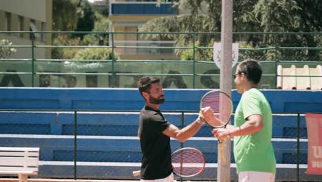 Two-tennis-players-greet-each-other-and-get-ready-to-play