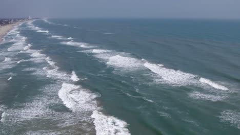 aerial-shot-of-the-beach-and-the-waves