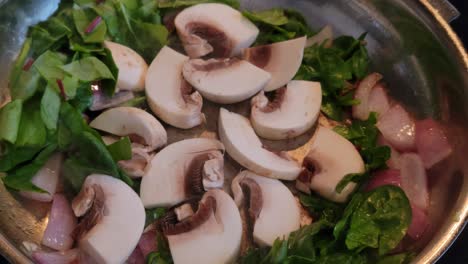 Sauté-mushrooms-onion-and-spinach-in-frying-pan