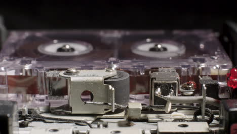 Exposed-Internal-Components-Of-Microcassette-Recorder-Playing