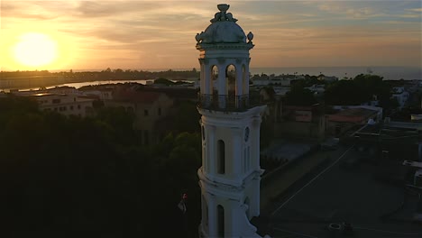 Palacio-Consistorial-and-cityscape-at-sunset,-Colonial-zone-in-Santo-Domingo